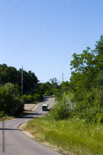 A road with grass and trees