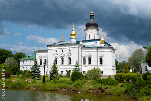 View of the ancient Cathedral of the Three Saints (1574) in the Spaso-Eleazarovsky Monastery on a June day. Elizarovo, Pskov Region, Russia