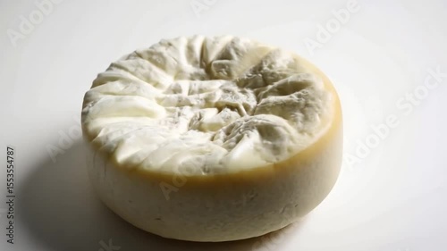 Discover the artistry behind this round cheese. It showcases intricate details and textures. Ideal for culinary projects and food photography. Generative AI