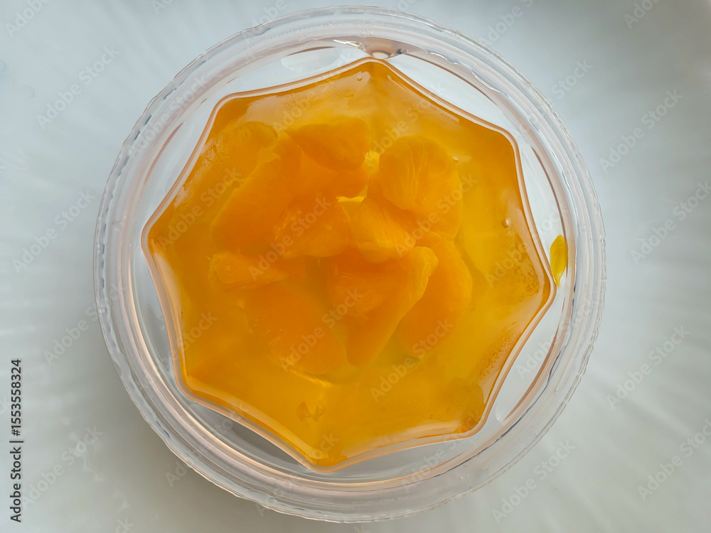 custom made wallpaper toronto digitalDelicious orange mandarin slices in jelly on a plate on a white table
