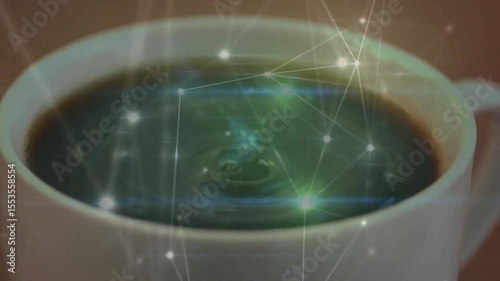 Droplet dropping in coffee cup starting ripples and network overlay pulsing showing connectivity