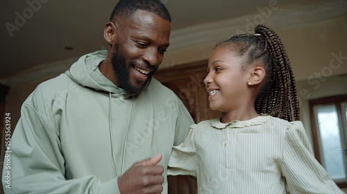 Father and child enjoy vinyl dance party in cozy living room heartwarming family bonding moment