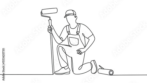 Painter in overalls and cap kneeling with paint roller and can