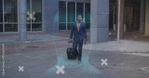 Businessman pulling suitcase wheel contacting ground in plaza activating data spheres, green scans