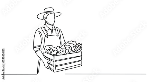 Farmer wearing a hat and overalls holds a wooden crate filled with fresh vegetables