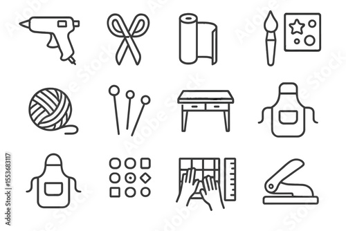 Craft tools collection: glue gun, scissors, yarn, needles, apron, paper, paintbrush, desk