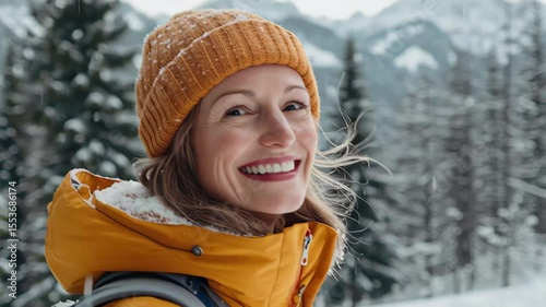 Mature female enjoying winter outdoors in a joyful moment with snow covered mountains in the background, Portrait of a mature female in winter outdoor, happy woman in scenic