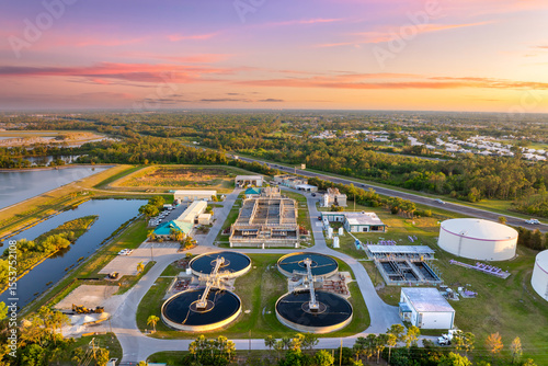 Large-scale industrial water treatment plant purifying and recycling water through filtration and chemical processes to meet health and safety standards