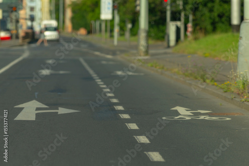 A designated bicycle lane has been painted prominently on the side of the road to ensure safer travel for cyclists, enhancing road safety