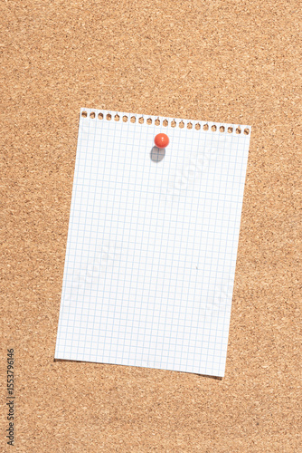 Blank grid paper sheet pinned on cork board. Template Mock up