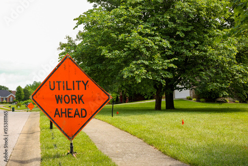 Φωτογραφία A utility work ahead sign in the  residential neighborhood