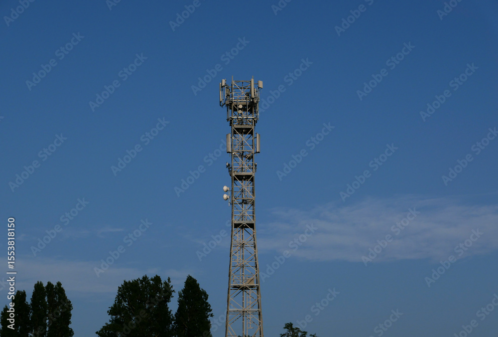 Obraz premium communication tower mast over blue sky
