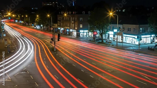 Night city street traffic light trails, shops background, urban transport