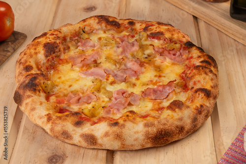Pizza with ham, curry pineapple and cheese