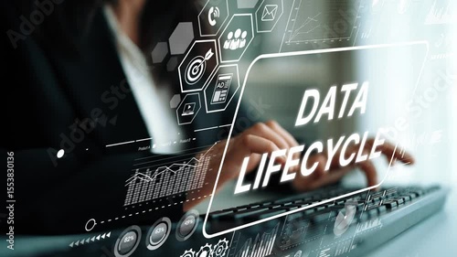 Professional analyzing data lifecycle trends with digital interface and financial graphs in modern office environment. Asymptotic smart data analytic.