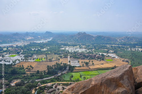 Climb to the top of the mountain, which offers a unique view of the beauty of the historical city of Hampi