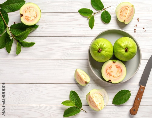 Fresh Green Guava Fruits and Leaves on White Wooden Background