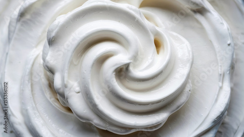 Macro view of whipped cream showing gentle curves and creamy texture, suitable for dessert or dairy themes