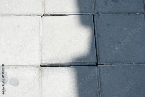 Uneven Pavement Tiles with Cracks and Shadows
