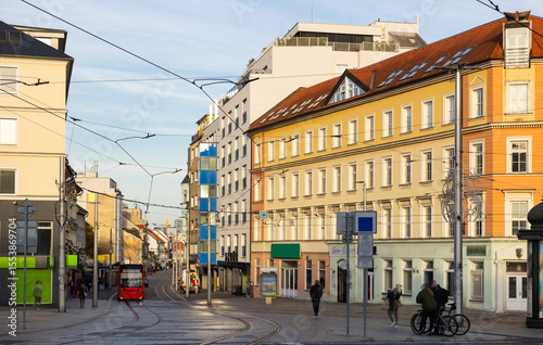 Canvas Print Modern tram travels along a quiet Hurbanovo street in Bratislava during a day wi