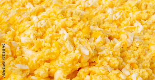 Scrambled eggs pattern, omelet wallpaper. Breakfast fried eggs stirred or beaten together