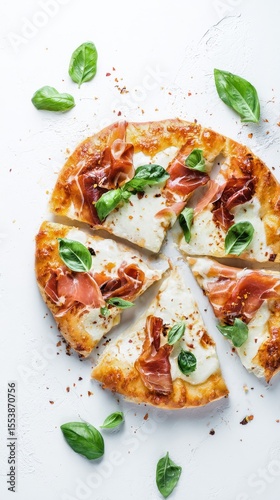 Delicious Prosciutto and Basil Pizza on a White Background Served in Slices a...