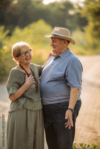 Happy elderly people walking in the park on a sunny day