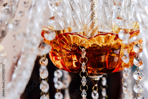 Elegant glass chandelier highlighting intricate design and craftsmanship in an indoor setting
