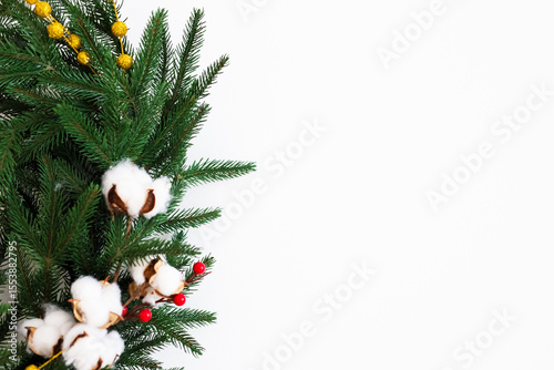 Decorative greenery with cotton and berries for a festive atmosphere during winter holidays