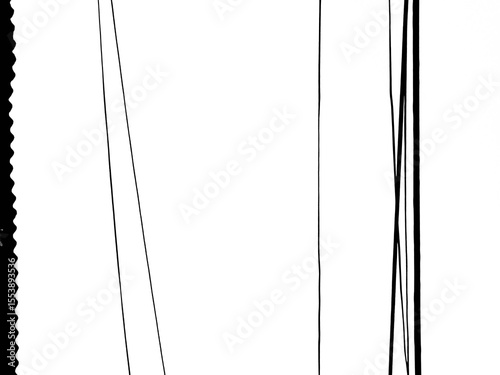 photograph of the electricity and internet cables, together with the edge of a tin roof over a white sky.