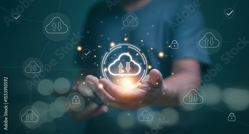 Cloud computing technology concept. Businessman holding cloud computing icon and link to network diagram on virtual screen. Online data storage, Digital data transfer, File backup storage protection.