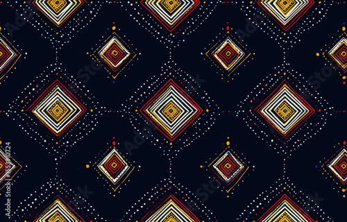 An ethnic geometric abstract pattern is used in graphic art to create a modern design on fabric or cloth, characterized by a textured background and a color scheme of red, yellow, white, and blue