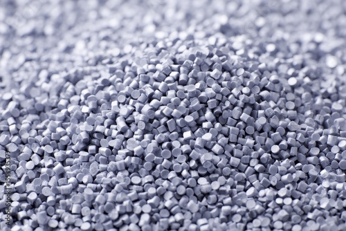 Close up texture of grey plastic resin granules for industrial use