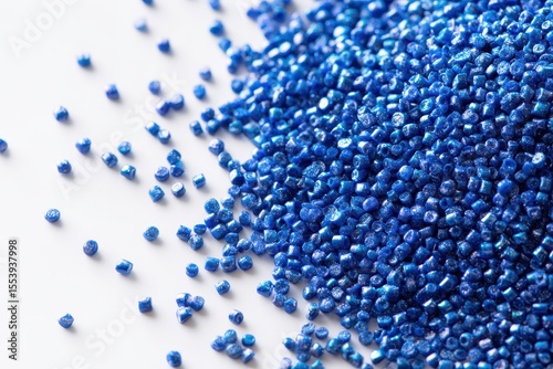 Cold cut blue polymer pigment granules on a white background for a plastic manufacturing catalog