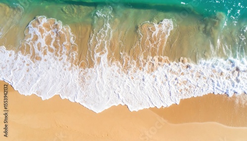 Aerial View Of Golden Sand Beach With Turquoise Water And Foamy Waves