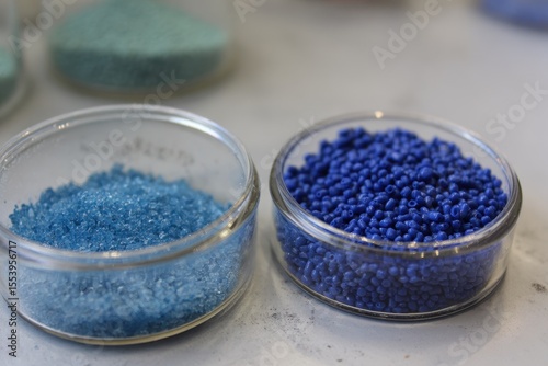 Two distinct blue plastic granules in the lab