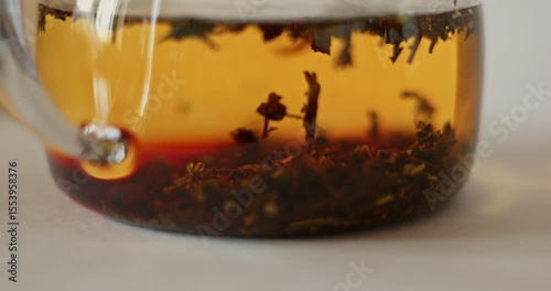 tea is brewed in a glass teapot, evaporation drops on the walls of the teapot