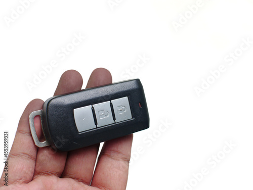 hand holding a Car Key on White Background. 