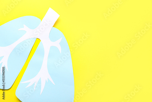 Paper lungs on yellow backg...