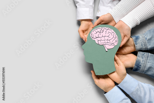 Women holding paper human h...