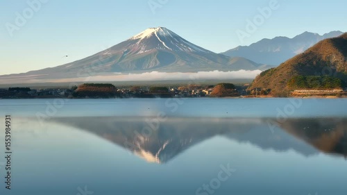 Majestic mount fuji reflecting on serene lake kawaguchiko during a tranquil morning