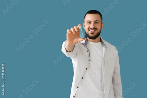 Young man with inhaler on b...