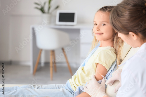 Female doctor vaccinating l...