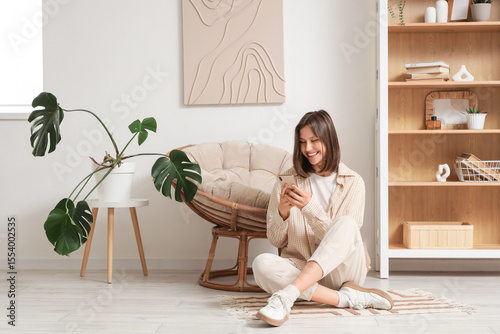 Young woman using mobile ph...