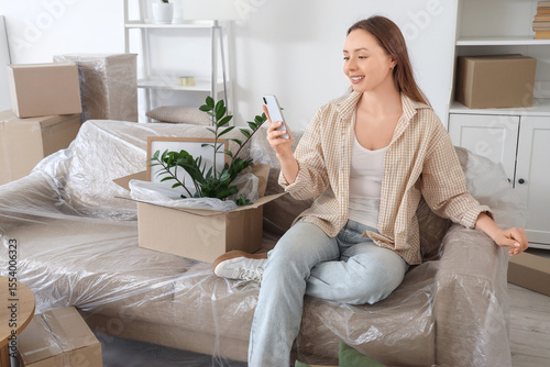 Young woman using mobile ph...