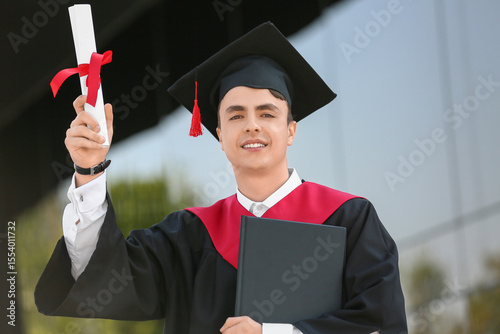 Male graduating student wit...
