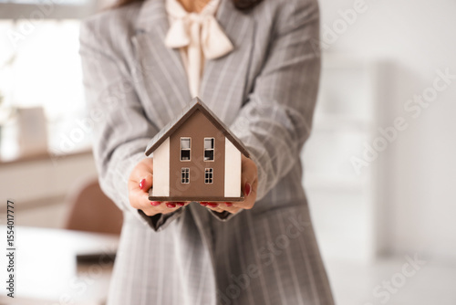Female real estate agent wi...