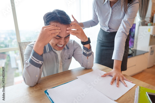 Canvastavla Indonesian southeast asian businessman gets scolded by his boss for being late or for the stress of deadlines