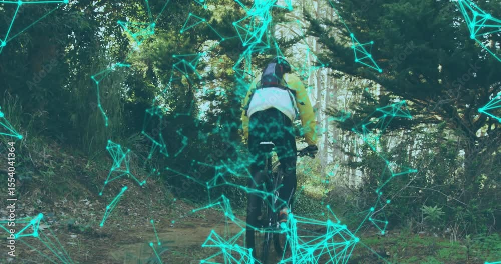 Cyclist rolling mountain bike into turquoise polygon tech overlay and lifting front wheel uphill