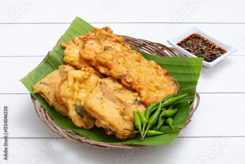 Indonesian food fritters bakwan jagung and fried tempeh with green chili and spicy soy sauce